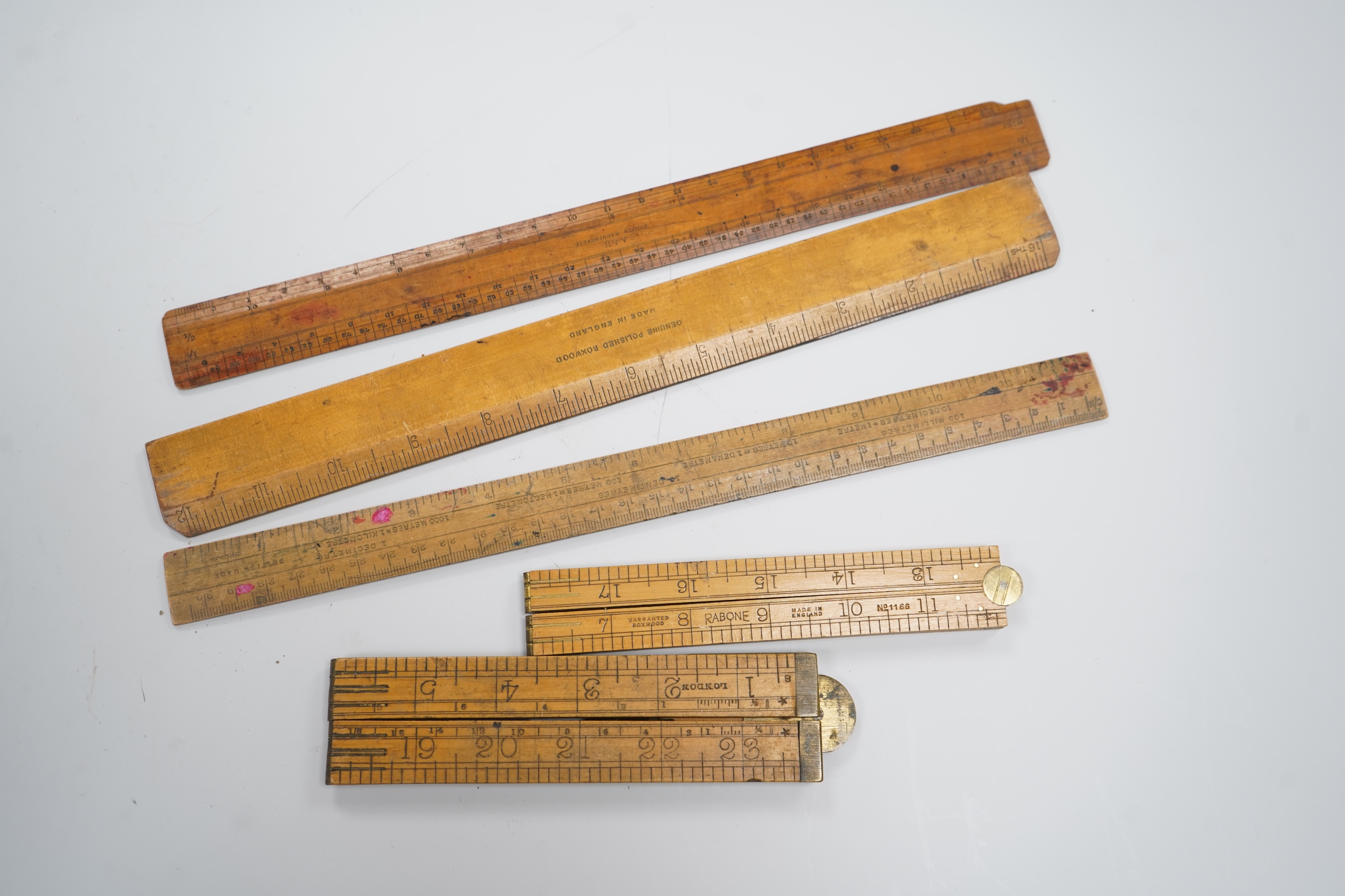 A large collection of thirty Antique and Vintage boxwood rules including the Jacob's Biscuits metal ruler. c.1900